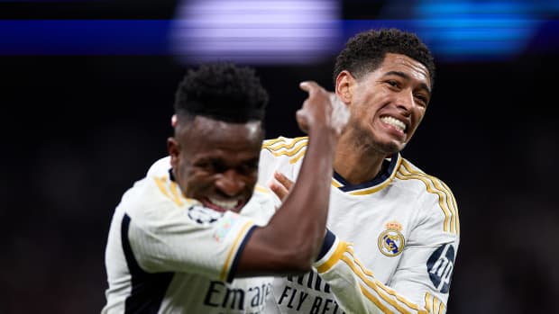 Vinicius Junior pictured (left) pointing at teammate Jude Bellingham while celebrating a goal during Real Madrid's 1-1 draw against RB Leipzig in March 2024